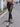 A Woman Wearing High-Waisted Gilded Camouflage Capes in Spring and Summer, Fashionable and Elegant Tight-Fitting Leggings