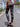 A Woman Wearing High-Waisted Gilded Camouflage Capes in Spring and Summer, Fashionable and Elegant Tight-Fitting Leggings