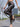 A Woman Wearing High-Waisted Gilded Camouflage Capes in Spring and Summer, Fashionable and Elegant Tight-Fitting Leggings