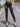 A Woman Wearing High-Waisted Gilded Camouflage Capes in Spring and Summer, Fashionable and Elegant Tight-Fitting Leggings